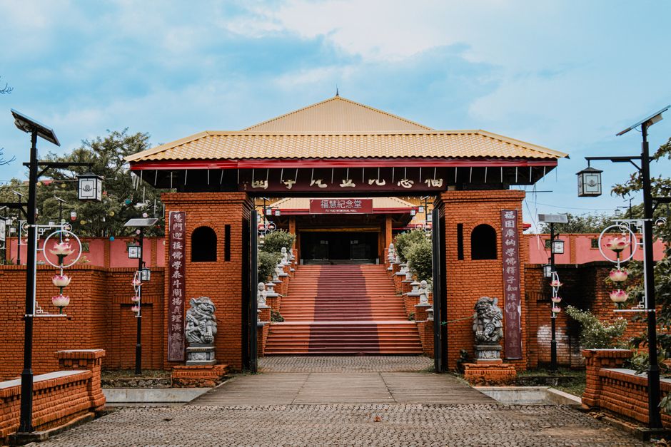 Photograph of a Buddhist temple entrance in Sri Lanka, featuring traditional architecture and red bricks.