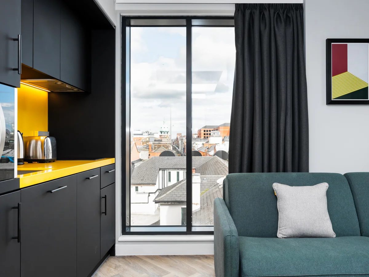 Staycity Dublin studio apartment with window, sofa and kitchenette